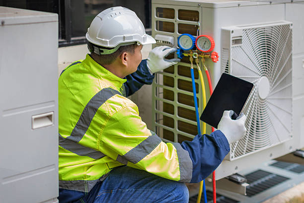 Professional Air Duct Cleaning technician working in Caldwell, NJ